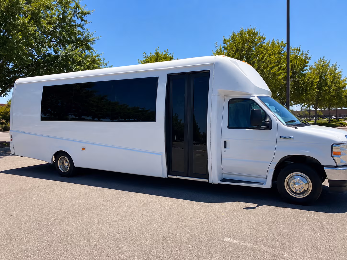 Wedding guests seated inside a party bus serving Thornton